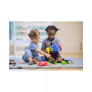 Two girls sharing legos