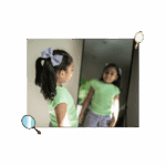 girl looking at herself in the mirror