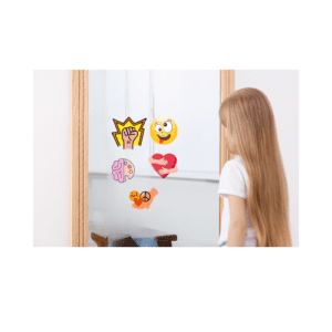 picture of girl looking in mirror and seeing graphic depictions of kindness, courage, compassion, creativity, and silliness.